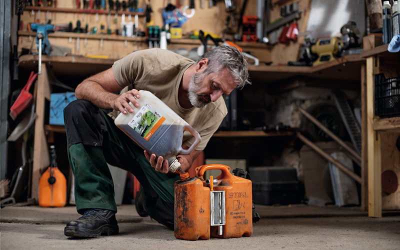 Man mixing fuel for his STIHL petrol tools