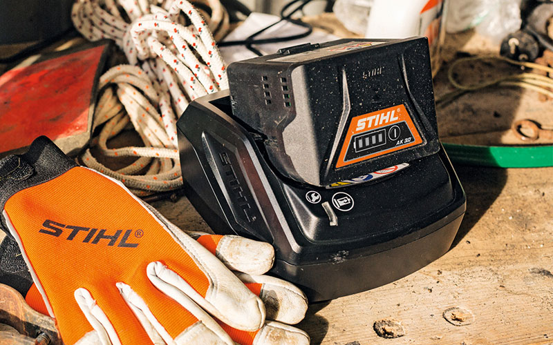 Close-up on Battery STIHL AK 10, AK 20, AK 30 plugged into the standard charger STIHL AL 101